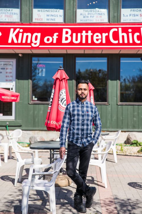 MIKAELA MACKENZIE / WINNIPEG FREE PRESS
Aman Bajwa, owner of King of Butter Chicken, poses for portraits by his restaurant in Winnipeg on Tuesday, May 14, 2019.  For Dave Sanderson story.
Winnipeg Free Press 2019.