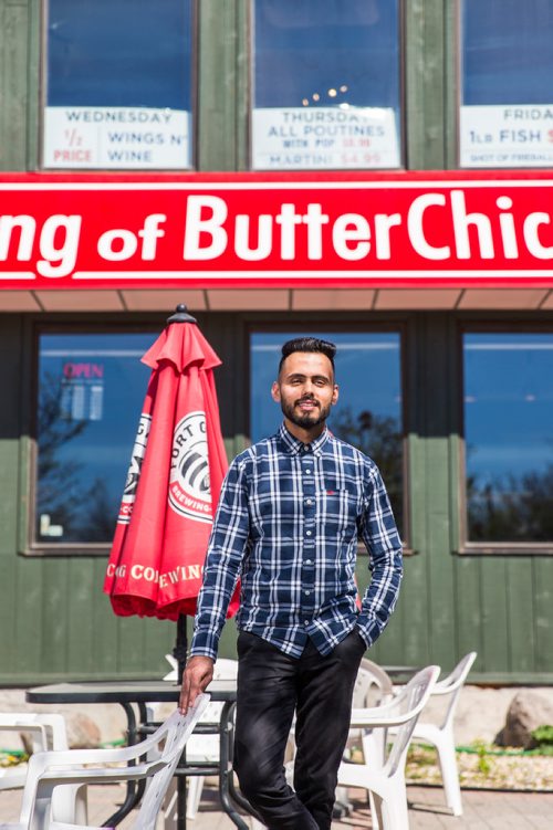 MIKAELA MACKENZIE / WINNIPEG FREE PRESS
Aman Bajwa, owner of King of Butter Chicken, poses for portraits by his restaurant in Winnipeg on Tuesday, May 14, 2019.  For Dave Sanderson story.
Winnipeg Free Press 2019.