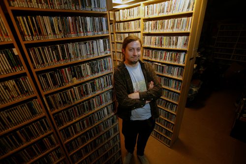 PHIL HOSSACK / WINNIPEG FREE PRESS - U of W's CKUW radio station is celebrating 20 years on FM radio: current program director, Sam Doucet poses in their music library. See story.  - May14, 2019, 2019.