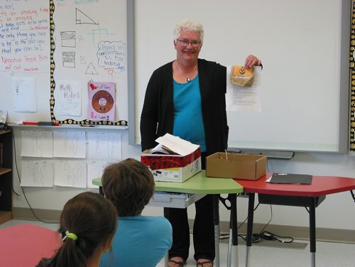 Canstar Community News May 7, 2019 - St. Francois Xavier Historical Society member Levina Cunningham shows a package of pumpkin seeds to be given to Grades 3, 4 and 5 students at St. Francois Xavier Community School on May 7. The students are encouraged to grow pumpkins and potatoes this summer. (ANDREA GEARY/CANSTAR COMMUNITY NEWS)