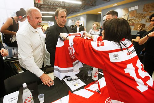 JOHN WOODS / WINNIPEG FREE PRESS
Former Winnipeg Jet and Hockey Helps the Homeless (HHTH) Ambassadors, Dave Babych, left, and his brother Wayne are presented with jerseys by Viola Bauer, HHTH Winnipeg co-chair, during a  press conference at Resource Assistance for Youth (RAY) in Winnipeg Tuesday, May 14, 2019. HHTH announced their Winnipeg tournament to assist local homeless service agencies. HHTH is a Canadian not-for-profit that hosts fantasy hockey tournaments, where amateur hockey players get to lace up with some of Canadas most admired NHL Alumni and Olympic Gold Medalists to raise awareness and funds that make a direct impact in their community. 
Reporter: Bell