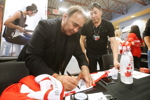 JOHN WOODS / WINNIPEG FREE PRESS
Former Winnipeg Jet and Hockey Helps the Homeless (HHTH) Ambassador, Wayne Babych, left, signs an autograph for Chief Dennis Meeches during a HHTH press conference at Resource Assistance for Youth (RAY) in Winnipeg Tuesday, May 14, 2019. HHTH announced their Winnipeg tournament to assist local homeless service agencies. HHTH is a Canadian not-for-profit that hosts fantasy hockey tournaments, where amateur hockey players get to lace up with some of Canadas most admired NHL Alumni and Olympic Gold Medalists to raise awareness and funds that make a direct impact in their community. 
Reporter: Bell