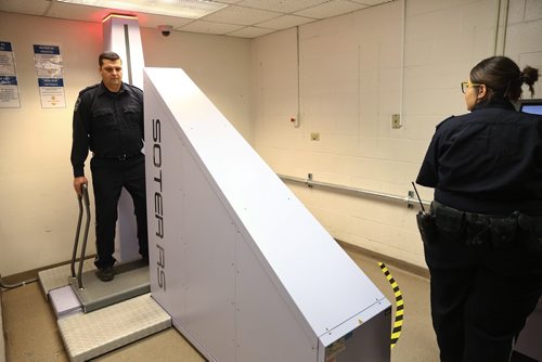 MIKE DEAL / WINNIPEG FREE PRESS
Correctional Officers Melissa and Clayton demonstrate the new body scanner in the Winnipeg Remand Centre during an announcement by Justice Minister Cliff Cullen Thursday morning. New scanners have been installed in correctional centres in Winnipeg, Brandon, and The Pas in an effort to keep drugs and other contraband out of Manitoba jails. 
190516 - Thursday, May 16, 2019
190516
Thursday, May 16, 2019