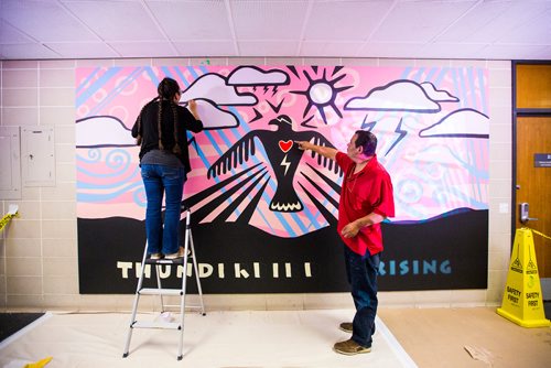 MIKAELA MACKENZIE / WINNIPEG FREE PRESS
Michif artist Christi Belcourt and Anishinaabe artist Isaac Murdoch create a mural titled Thunderbird Uprising in a hallway in the Isbister Building of the Faculty of Arts at the University of Manitoba in Winnipeg on Thursday, May 16, 2019. 
Winnipeg Free Press 2019.