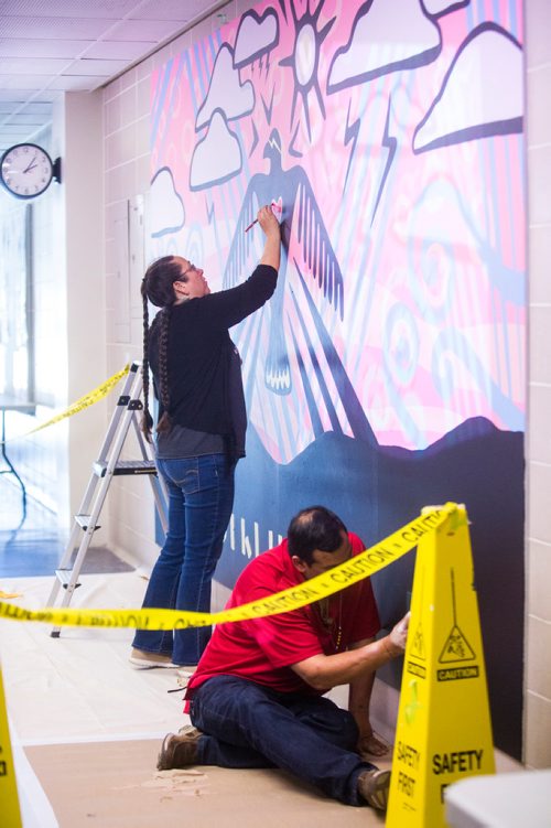 MIKAELA MACKENZIE / WINNIPEG FREE PRESS
Michif artist Christi Belcourt and Anishinaabe artist Isaac Murdoch create a mural titled Thunderbird Uprising in a hallway in the Isbister Building of the Faculty of Arts at the University of Manitoba in Winnipeg on Thursday, May 16, 2019. 
Winnipeg Free Press 2019.
