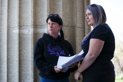 MIKE DEAL / WINNIPEG FREE PRESS
Carrying an armful of documents she is handing over to the NDP the Official Opposition, Arlene Last-Kolb (left) has been working with Rebecca Rummery (right) cofounder of Overdose Manitoba to petition the provincial government to take action on the addictions crises.
190517 - Friday, May 17, 2019.