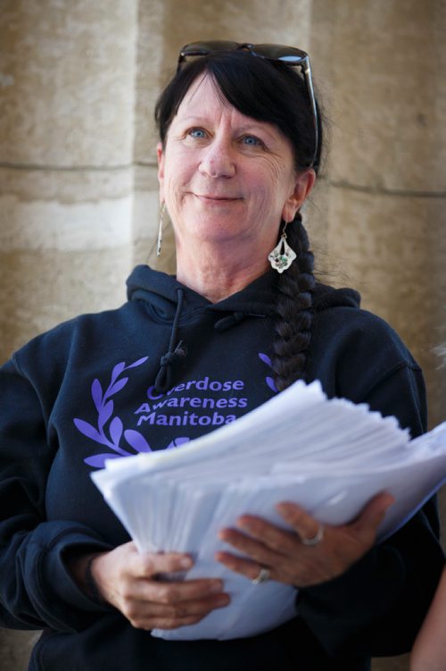 MIKE DEAL / WINNIPEG FREE PRESS
Carrying an armful of documents she is handing over to the NDP the Official Opposition, Arlene Last-Kolb has been working with Overdose Manitoba to petition the provincial government to take action on the addictions crises.
190517 - Friday, May 17, 2019.