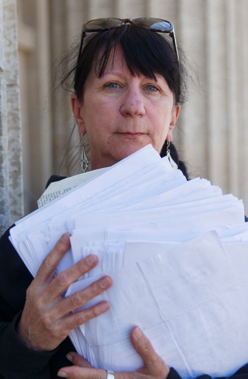 MIKE DEAL / WINNIPEG FREE PRESS
Carrying an armful of documents she is handing over to the NDP the Official Opposition, Arlene Last-Kolb has been working with Overdose Manitoba to petition the provincial government to take action on the addictions crises.
190517 - Friday, May 17, 2019.