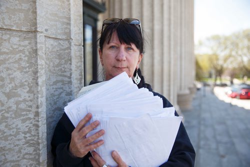 MIKE DEAL / WINNIPEG FREE PRESS
Carrying an armful of documents she is handing over to the NDP the Official Opposition, Arlene Last-Kolb has been working with Overdose Manitoba to petition the provincial government to take action on the addictions crises.
190517 - Friday, May 17, 2019.