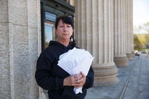 MIKE DEAL / WINNIPEG FREE PRESS
Carrying an armful of documents she is handing over to the NDP the Official Opposition, Arlene Last-Kolb has been working with Overdose Manitoba to petition the provincial government to take action on the addictions crises.
190517 - Friday, May 17, 2019.