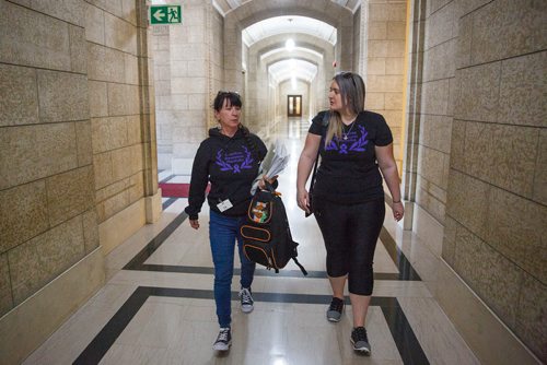 MIKE DEAL / WINNIPEG FREE PRESS
Carrying an armful of documents she is handing over to the NDP the Official Opposition, Arlene Last-Kolb (left) has been working with Rebecca Rummery (right) cofounder of Overdose Manitoba to petition the provincial government to take action on the addictions crises.
190517 - Friday, May 17, 2019.