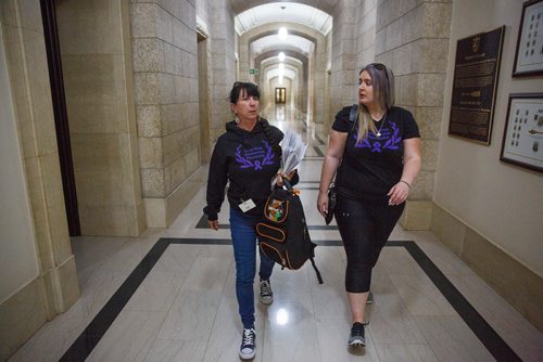 MIKE DEAL / WINNIPEG FREE PRESS
Carrying an armful of documents she is handing over to the NDP the Official Opposition, Arlene Last-Kolb (left) has been working with Rebecca Rummery (right) cofounder of Overdose Manitoba to petition the provincial government to take action on the addictions crises.
190517 - Friday, May 17, 2019.