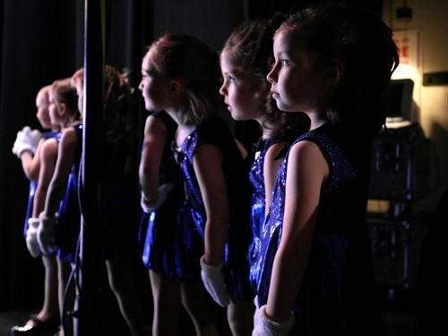 Brandon Sun Beginning students at the Steppin' Time dance studio await their turn onstage Wednesday night during the school's first of two year-end shows at the Centennial Auditorium. (Colin Corneau/Brandon Sun)