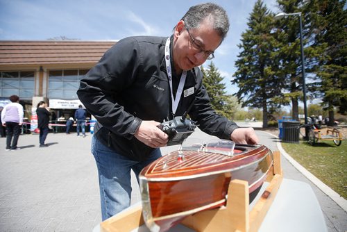 JOHN WOODS / WINNIPEG FREE PRESS
Craig Martin of the Winnipeg Model Boat Club changes the battery in his model 1940 Chris Craft Barrelback Runabout at the Assiniboine Park duck pond in Winnipeg Sunday, May 19, 2019. 
Reporter: Intersection - Sanderson