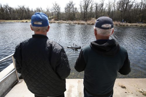 JOHN WOODS / WINNIPEG FREE PRESS
Jack Jansen, left, and Dick Toews of the Winnipeg Model Boat Club operate their model boats at the Assiniboine Park duck pond in Winnipeg Sunday, May 19, 2019. 
Reporter: Intersection - Sanderson