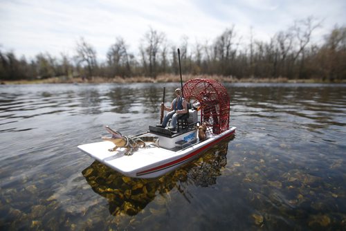 JOHN WOODS / WINNIPEG FREE PRESS
Jack Jansen of the Winnipeg Model Boat Club operates his model air swamp boat, which he powers with an airplane engine and dedicated to his deceased friend Don Froewerk, at the Assiniboine Park duck pond in Winnipeg Sunday, May 19, 2019. 
Reporter: Intersection - Sanderson