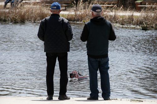 JOHN WOODS / WINNIPEG FREE PRESS
Jack Jansen, left, and Dick Toews of the Winnipeg Model Boat Club operate their model boats at the Assiniboine Park duck pond in Winnipeg Sunday, May 19, 2019. 
Reporter: Intersection - Sanderson