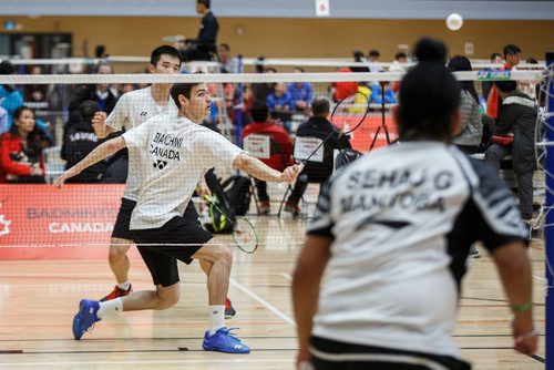 MIKE DEAL / WINNIPEG FREE PRESS
Alexander Bianchini returns the birdie over the net during his doubles match with partner Kevin Wang against Sehaj Ghotra and Aaskash Natarajan during the 2019 Junior/U23 National Badminton Championships at the Sport for Life Centre Wednesday morning.
190522 - Wednesday, May 22, 2019.