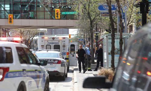 RUTH BONNEVILLE / WINNIPEG FREE PRESS 

LOCAL - Winnipeg Police and emergency personal at a scene on Portage Ave. at Carlton Street Thursday afternoon.  

No other information is available at this time but filed this photo just in case police report something at a later date.    

May 23, 2019
