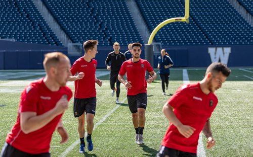 SASHA SEFTER / WINNIPEG FREE PRESS
Valour FC Midfielder Dylan Sacramento (middle, right) runs through drills during a team practice on Investors Group Field.
190523 - Thursday, May 23, 2019.