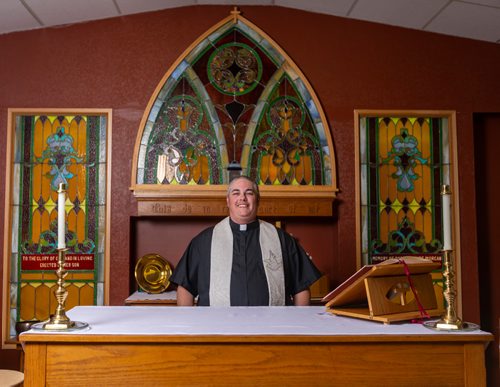 SASHA SEFTER / WINNIPEG FREE PRESS
New Anglican Deacon Theo Robinson wears his stole which features a trans flag inside his Transcona church.
190523 - Thursday, May 23, 2019.