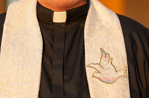 SASHA SEFTER / WINNIPEG FREE PRESS
New Anglican Deacon Theo Robinson wears his stole which features a trans flag outside his Transcona church.
190523 - Thursday, May 23, 2019.