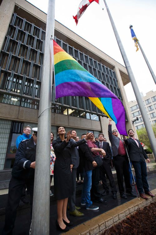 MIKE DEAL / WINNIPEG FREE PRESS
The Pride Winnipeg Flag is raised at City Hall Friday morning with Mayor Brian Bowman, Muhammad Ahsan, president of Pride Winnipeg and other dignitaries in attendance.
190524 - Friday, May 24, 2019.