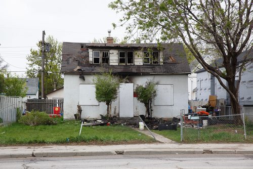MIKE DEAL / WINNIPEG FREE PRESS
The burnt out shell of a house in the 400-block of Nairn Avenue near Archibald Street where a standoff and fire capped off a days-long crime spree by a 29-year-old Winnipeg man Thursday evening.
190524 - Friday, May 24, 2019.