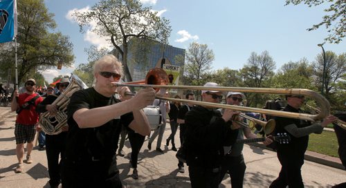PHIL HOSSACK / WINNIPEG FREE PRESS - A proud and loud union member blows his trombone down broadway ave Saturday during a parade to remember the 1919 General Strike. See Melissa Martin Story.  - May 25, 2019.