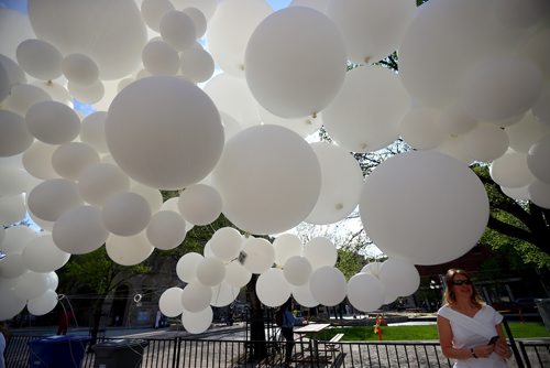 TREVOR HAGAN / WINNIPEG FREE PRESS
Laurena Ens checks out the balloons at the Genuwine Cellars table at Table for 1200 More along Albert Street, Saturday, May 25, 2019.