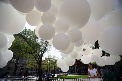 TREVOR HAGAN / WINNIPEG FREE PRESS
Laurena Ens checks out the balloons at the Genuwine Cellars table at Table for 1200 More along Albert Street, Saturday, May 25, 2019.