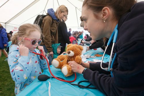 JOHN WOODS / WINNIPEG FREE PRESS
Rural paramedic Elizabeth MacKay helps Millie Hannah hear her bears heart beat at the Teddy Bear Picnic in Assiniboine Park, Winnipeg Sunday, May 26, 2019.

Reporter: ?
