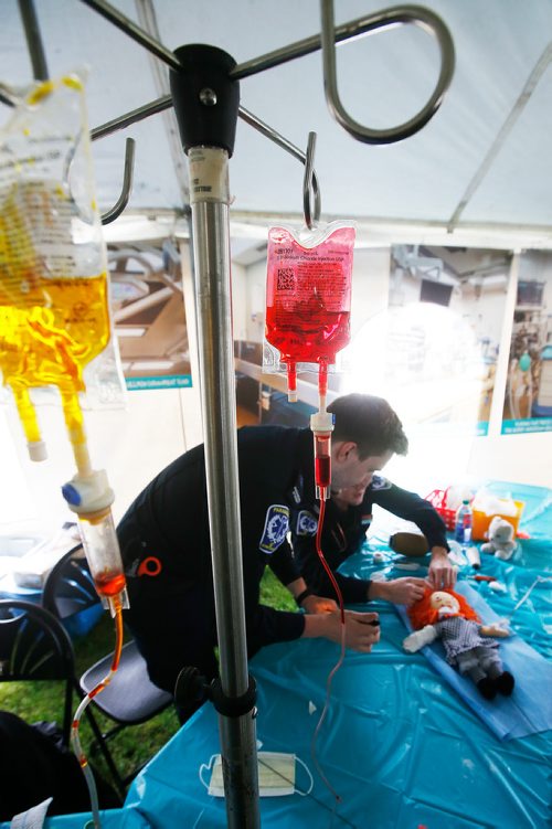 JOHN WOODS / WINNIPEG FREE PRESS
Paramedic students Joshua Van Walleghem and Andre Hiebert perform surgery on a stuffed toy at the Teddy Bear Picnic in Assiniboine Park, Winnipeg Sunday, May 26, 2019.

Reporter: ?