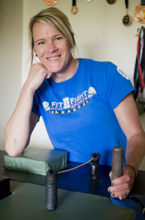 Canstar Community News May 29, 2019 - In 2016, Donna Purdy-Guspodarchuk first tried her hand at arm wrestling. The 44-year-old from Lord Roberts is now a familiar face on the national arm wrestling circuit, collecting a number of trophies and medals along the way. Filling more than her trophy case, arm wrestling helped motivate Purdy-Guspodarchuk fight through kidney cancer treatment and depression and mental illness. Purdy-Guspodarchuk defends her championship belt in Lloydminister, Alta. on June 2. (DANIELLE DA SILVA/SOUWESTER/CANSTAR)
