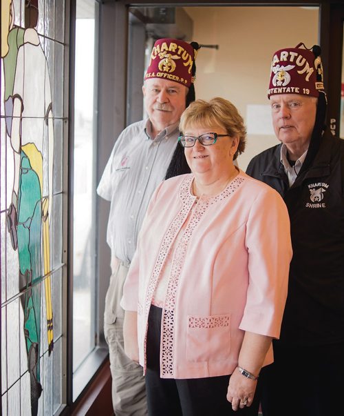 Canstar Community News May 29, 2019 - The Khartum Shriners are hosting its first "Memories" reunion barbecue at the temple on Wilkes Avenue on June 2. They are hoping patients and families who received treatment at Shriners hospitals in Winnipeg and elsehwere, as well as members of the general public, will drop by for an afternoon of reminiscing and fun activties, including clowns, trike demonstrations, and musical performances. Pictured from left, Don Thomson, Brenda McKechnie, and Doug McKechnie. (DANIELLE DA SILVA/SOUWESTER/CANSTAR)