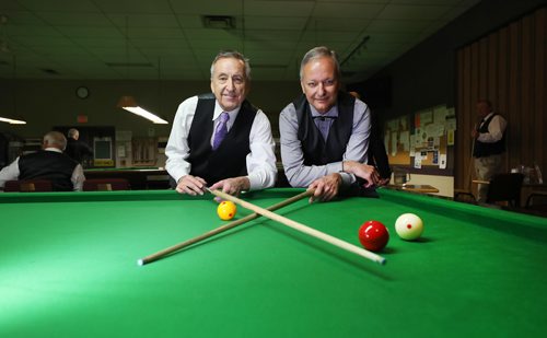 RUTH BONNEVILLE /  WINNIPEG FREE PRESS 

SPORTS - ENGLISH BILLIARDS, 

Photos of world class players taking part in the English Billiards tournament at the  Army Navy Air Force Veterans legion at 3584 Portage Ave. Monday.  

Photo of tournament organizers Garry Marshall (left) and Kevin Augusta at event.  

World Professional Billiards and Snooker Association (WPBSA).

WHAT IS English billiards,: called simply billiards[2] in the United Kingdom, is a cue sport that combines the aspects of carom billiards and pocket billiards. Two cue balls, (one white, one yellow) and a red object ball are used. Each player or team uses a different cue ball. It is played on a billiards table with the same dimensions as a snooker table and points are scored for cannons and pocketing the balls. English billiards has also been referred to as "the English game", "the all-in game" and (formerly) "the common game".





May 27, 2019
