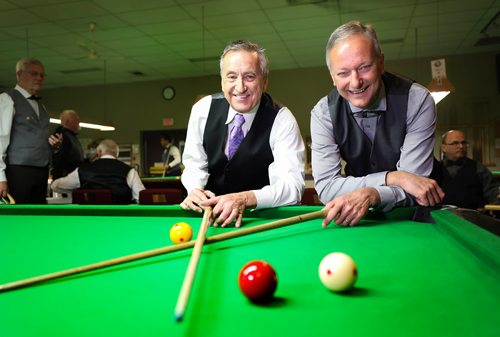 RUTH BONNEVILLE /  WINNIPEG FREE PRESS 

SPORTS - ENGLISH BILLIARDS, 

Photos of world class players taking part in the English Billiards tournament at the  Army Navy Air Force Veterans legion at 3584 Portage Ave. Monday.  

Photo of tournament organizers Garry Marshall (left) and Kevin Augusta at event.  

World Professional Billiards and Snooker Association (WPBSA).

WHAT IS English billiards,: called simply billiards[2] in the United Kingdom, is a cue sport that combines the aspects of carom billiards and pocket billiards. Two cue balls, (one white, one yellow) and a red object ball are used. Each player or team uses a different cue ball. It is played on a billiards table with the same dimensions as a snooker table and points are scored for cannons and pocketing the balls. English billiards has also been referred to as "the English game", "the all-in game" and (formerly) "the common game".





May 27, 2019
