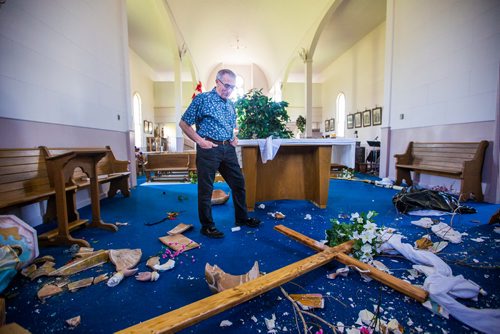 MIKAELA MACKENZIE / WINNIPEG FREE 
Eugene Bernardin looks at the fir cross he made tipped over among the rubble of smashed sculptures on the vandalized altar at St. Francois Xavier Catholic Church in the small town west of Winnipeg on Monday, May 27, 2019.  For Bill Redekop story.
Winnipeg Free Press 2019.