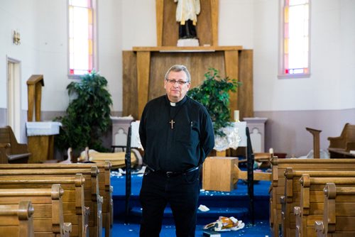 MIKAELA MACKENZIE / WINNIPEG FREE 
Fr. Michel Nault walks through the vandalized St. Francois Xavier Catholic Church in the small town west of Winnipeg on Monday, May 27, 2019.  For Bill Redekop story.
Winnipeg Free Press 2019.
