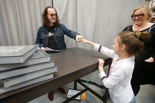 JOHN WOODS / WINNIPEG FREE PRESS
Canadian rock star Geddy Lee, lead singer and bassist of the band Rush, fist bumps Tesslyn Willey after signing copies of his new book Geddy Lee - Big Beautiful Book of Bass in Winnipeg Monday, May 27, 2019.

Reporter: ?