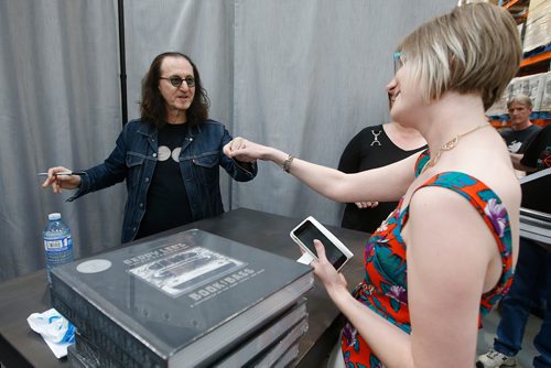 JOHN WOODS / WINNIPEG FREE PRESS
Canadian rock star Geddy Lee, lead singer and bassist of the band Rush, fist bumps a fan after signing copies of his new book Geddy Lee - Big Beautiful Book of Bass in Winnipeg Monday, May 27, 2019.

Reporter: ?