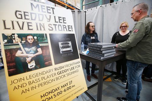 JOHN WOODS / WINNIPEG FREE PRESS
Canadian rock star Geddy Lee, lead singer and bassist of the band Rush, signs copies of his new book Geddy Lee - Big Beautiful Book of Bass for Gabriel Tuba, who was first in line at 6:50 am in Winnipeg Monday, May 27, 2019.

Reporter: ?