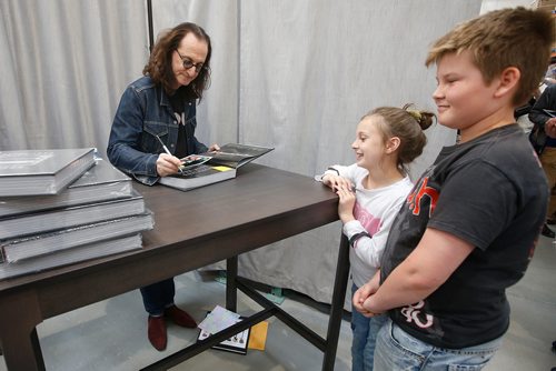 JOHN WOODS / WINNIPEG FREE PRESS
Canadian rock star Geddy Lee, lead singer and bassist of the band Rush, signs a copy of his new book Geddy Lee - Big Beautiful Book of Bass Tesslyn Willey and her brother Caiden in Winnipeg Monday, May 27, 2019. Caiden was 3 years old when he first saw Rush in Vancouver. He's now 11 and seen them 3 times.


Reporter: ?