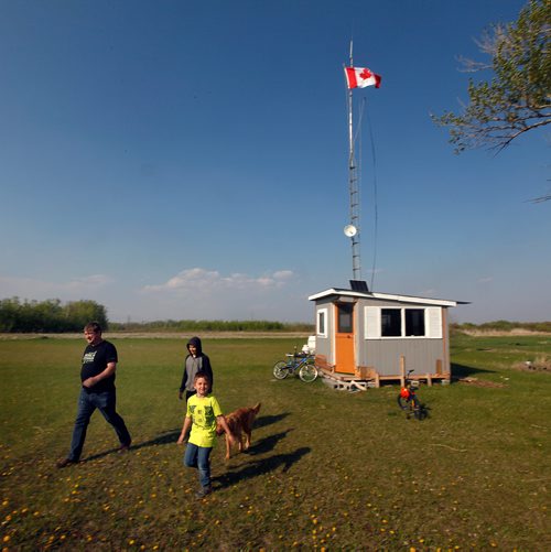 PHIL HOSSACK / WINNIPEG FREE PRESS - Ham Radio enthusiast Bill Fleury and his sons Avi (12) and Billy (7) right, walk away from their East Kildonan "Ham Shack". See Dave Sanderson's story. - May 28, 2019.