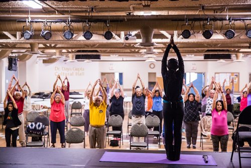 MIKAELA MACKENZIE / WINNIPEG FREE PRESS
Vadivambal Rajagopal leads the yoga part of the Sharing Circle of Wellness class, where seniors meet weekly for yoga, wellness topics, and lunch, at the Hindu Temple on St. Anne's Road in Winnipeg on Tuesday, May 28, 2019.  For Brenda Suderman story.
Winnipeg Free Press 2019.