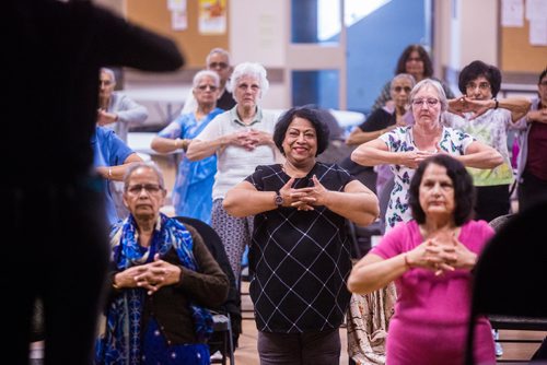 MIKAELA MACKENZIE / WINNIPEG FREE PRESS
Sumita Biswas (centre) participates in the Sharing Circle of Wellness class, where seniors meet weekly for yoga, wellness topics, and lunch, at the Hindu Temple on St. Anne's Road in Winnipeg on Tuesday, May 28, 2019.  For Brenda Suderman story.
Winnipeg Free Press 2019.