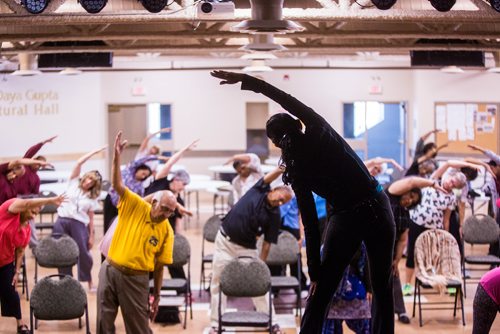 MIKAELA MACKENZIE / WINNIPEG FREE PRESS
Vadivambal Rajagopal leads the yoga part of the Sharing Circle of Wellness class, where seniors meet weekly for yoga, wellness topics, and lunch, at the Hindu Temple on St. Anne's Road in Winnipeg on Tuesday, May 28, 2019.  For Brenda Suderman story.
Winnipeg Free Press 2019.