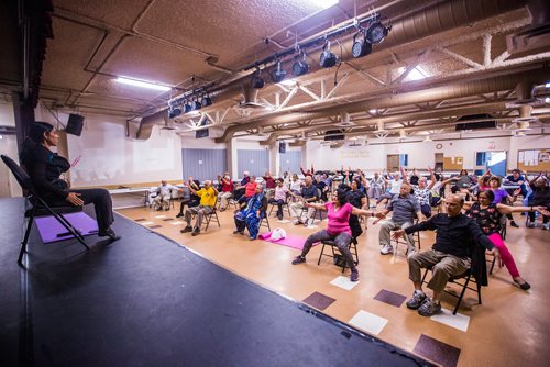 MIKAELA MACKENZIE / WINNIPEG FREE PRESS
Vadivambal Rajagopal leads the yoga part of the Sharing Circle of Wellness class, where seniors meet weekly for yoga, wellness topics, and lunch, at the Hindu Temple on St. Anne's Road in Winnipeg on Tuesday, May 28, 2019.  For Brenda Suderman story.
Winnipeg Free Press 2019.