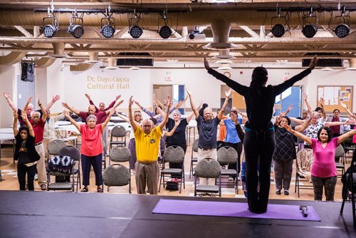 MIKAELA MACKENZIE / WINNIPEG FREE PRESS
Vadivambal Rajagopal leads the yoga part of the Sharing Circle of Wellness class, where seniors meet weekly for yoga, wellness topics, and lunch, at the Hindu Temple on St. Anne's Road in Winnipeg on Tuesday, May 28, 2019.  For Brenda Suderman story.
Winnipeg Free Press 2019.