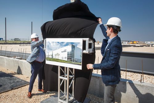 MIKE DEAL / WINNIPEG FREE PRESS
André Touchette (left), founder of Groupe Touchette, and Kevin Lutfy (right), Director, Real Estate at Groupe Touchette the largest Canadian-owned tire distributor, unveil a architectural rendering of their new 100,000 square foot facility in the Brookside Industrial Park in CentrePort Wednesday morning.
190529 - Wednesday, May 29, 2019.